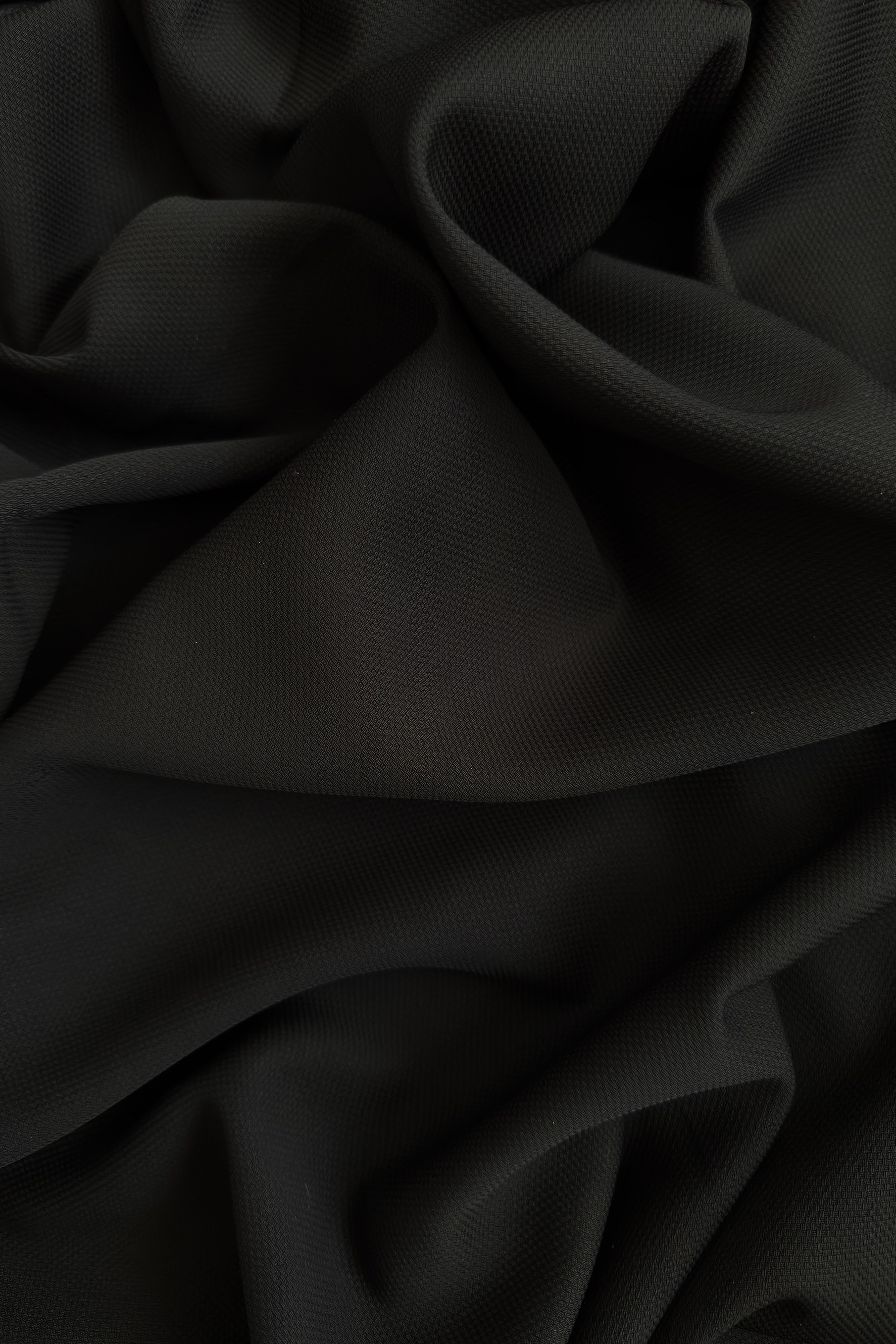 پارچه کرپ بیسکوییتی رنگ مشکی(متری 280/0000)